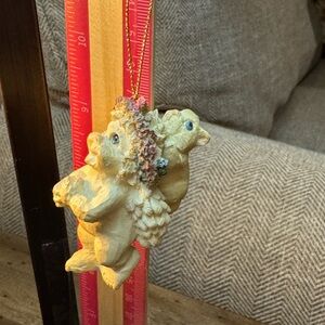 VTG Dreamsicles cherub ornament w/a wildflower crown small rabbit on back